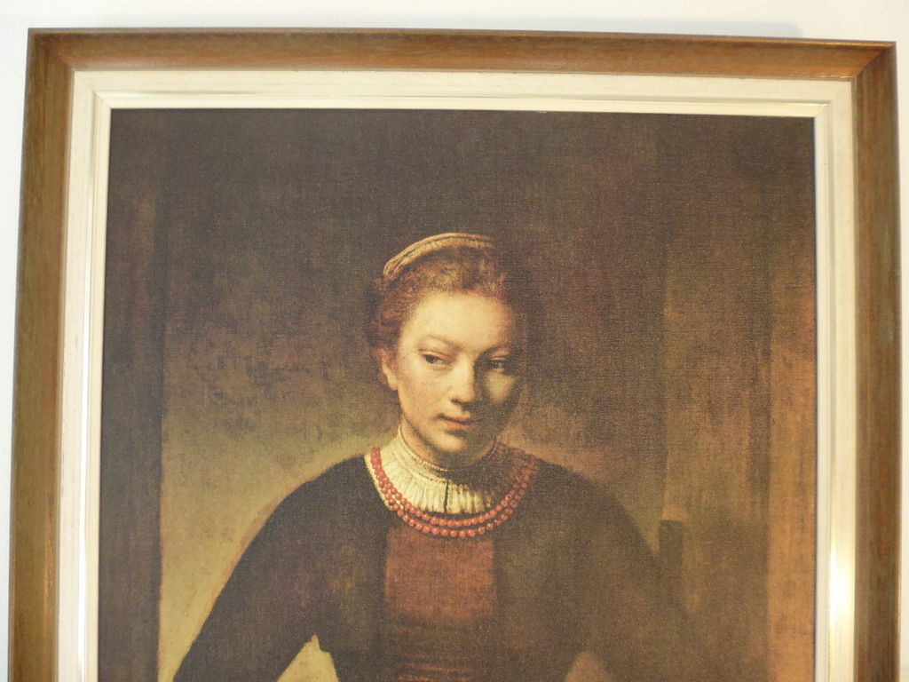 Rembrandt reproductie "jonge vrouw over onderdeur kijkend" nr2