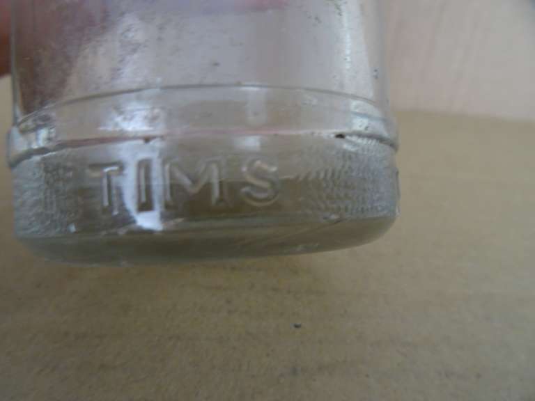 Bodemvondst glazen flesje Tims