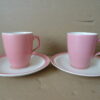 Antieke pastel roze kop en schotels